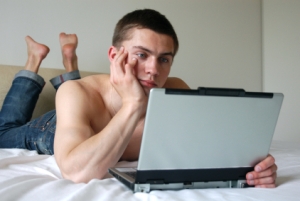 Sexy Man Working on Laptop